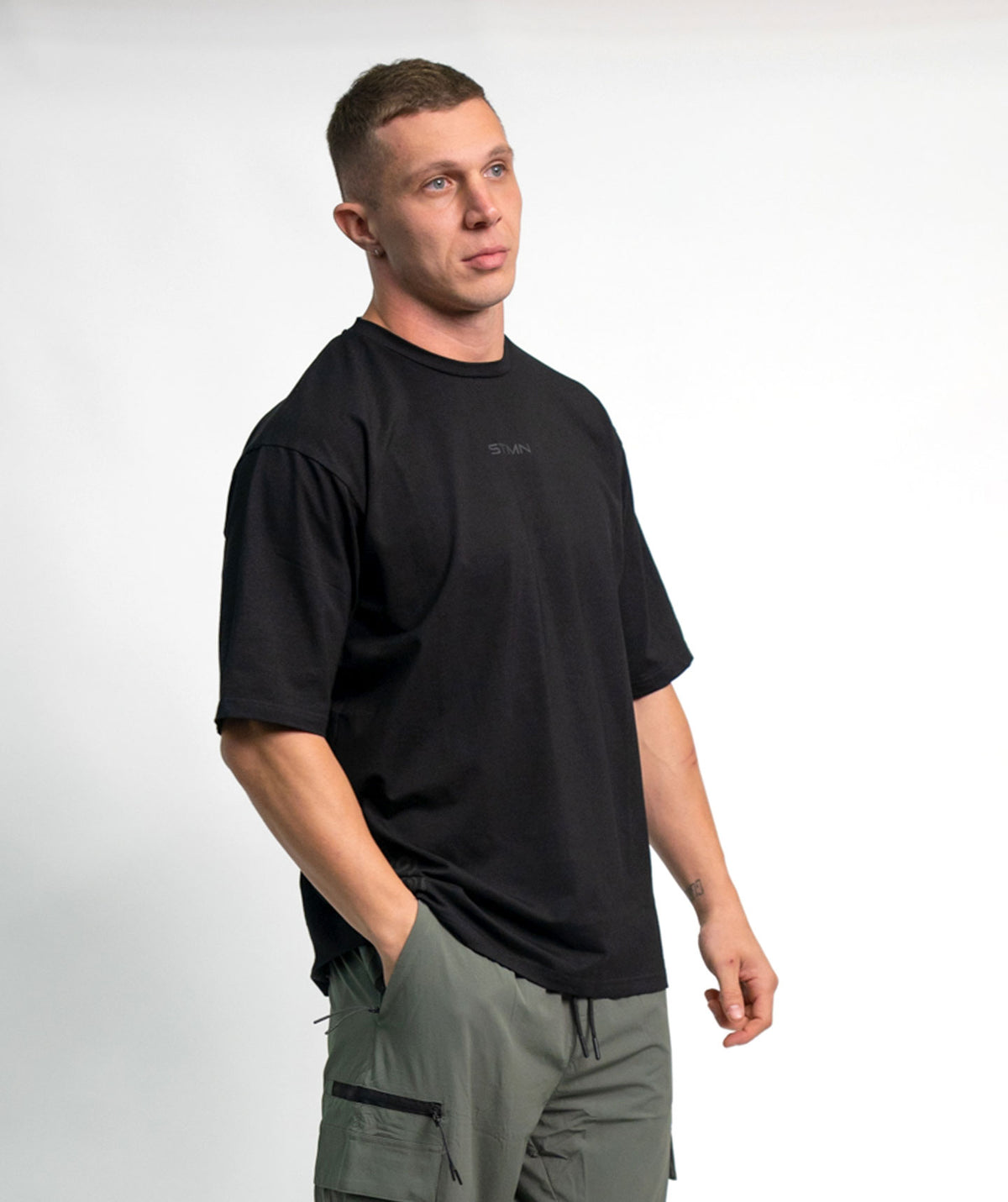 "BE A GAME CHANGER" Loose-Fit Tee SOLID Black Unisex - STMN Fitness