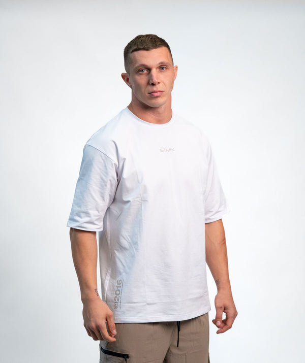 "BE A GAME CHANGER" Loose-Fit Tee SOLID White Unisex - STMN Fitness