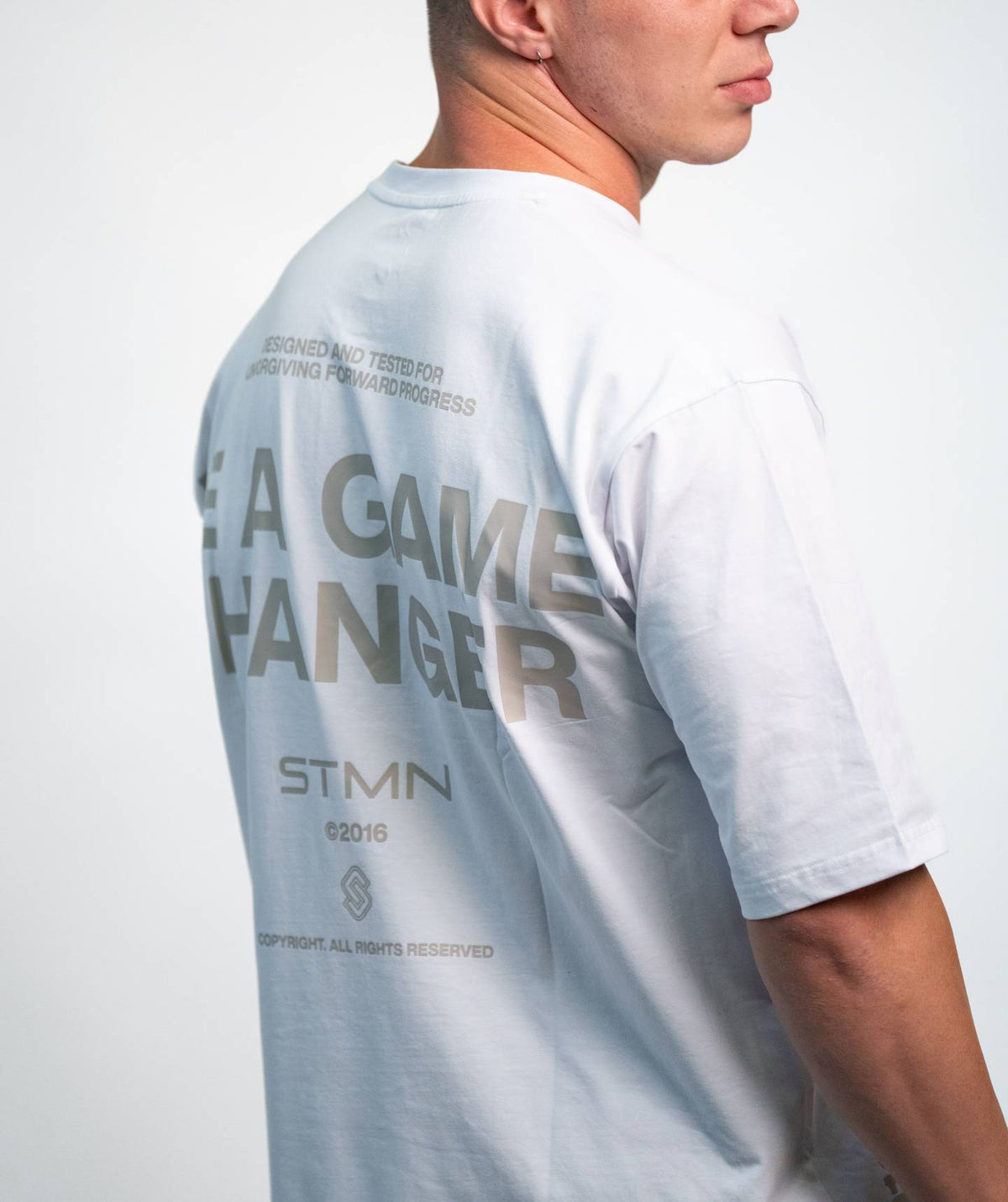 "BE A GAME CHANGER" Loose-Fit Tee SOLID White Unisex - STMN Fitness