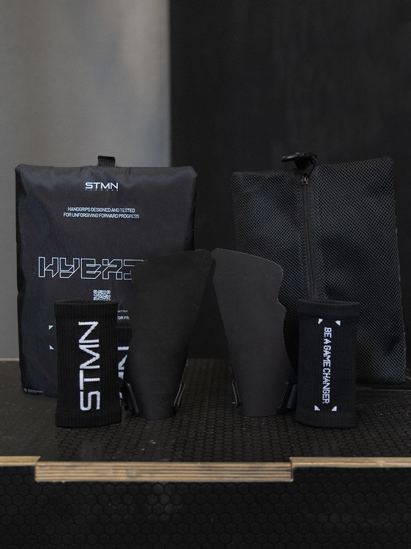 Confezione completa paracalli Hybrid STMN Fitness: coppia di grips, sacchetto in mesh e packaging dedicato