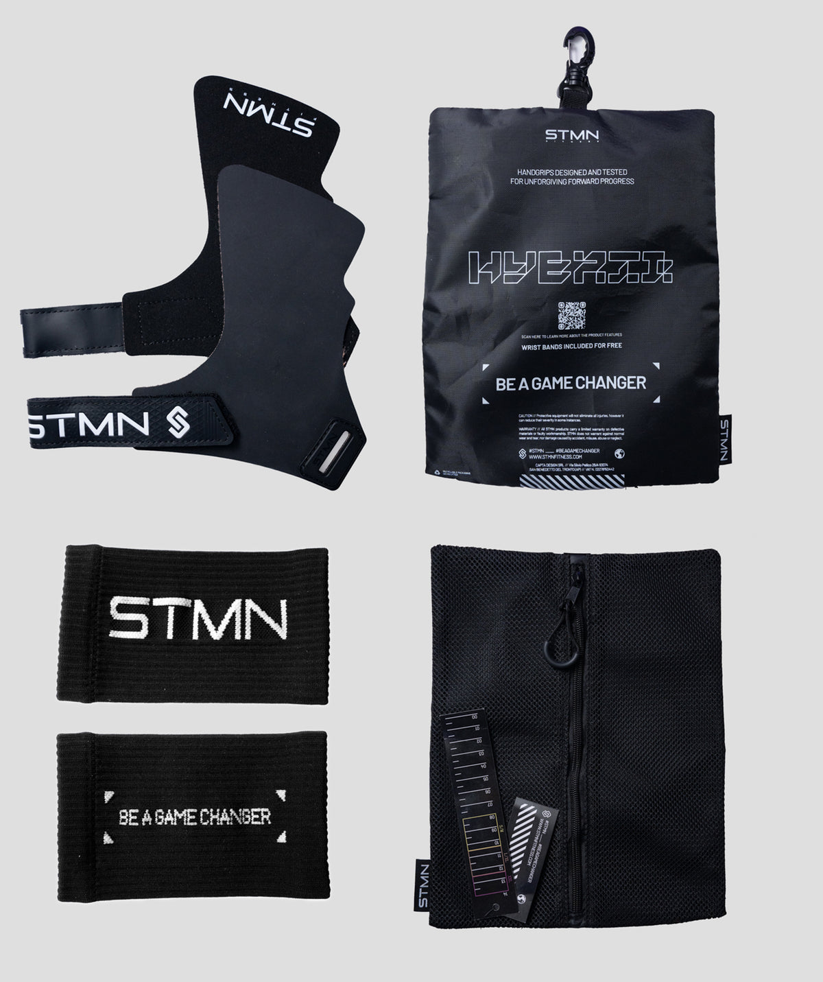 Contenuto della confezione paracalli Hybrid STMN Fitness: coppia di grips, polsini in omaggio, sacchetto in mesh e packaging