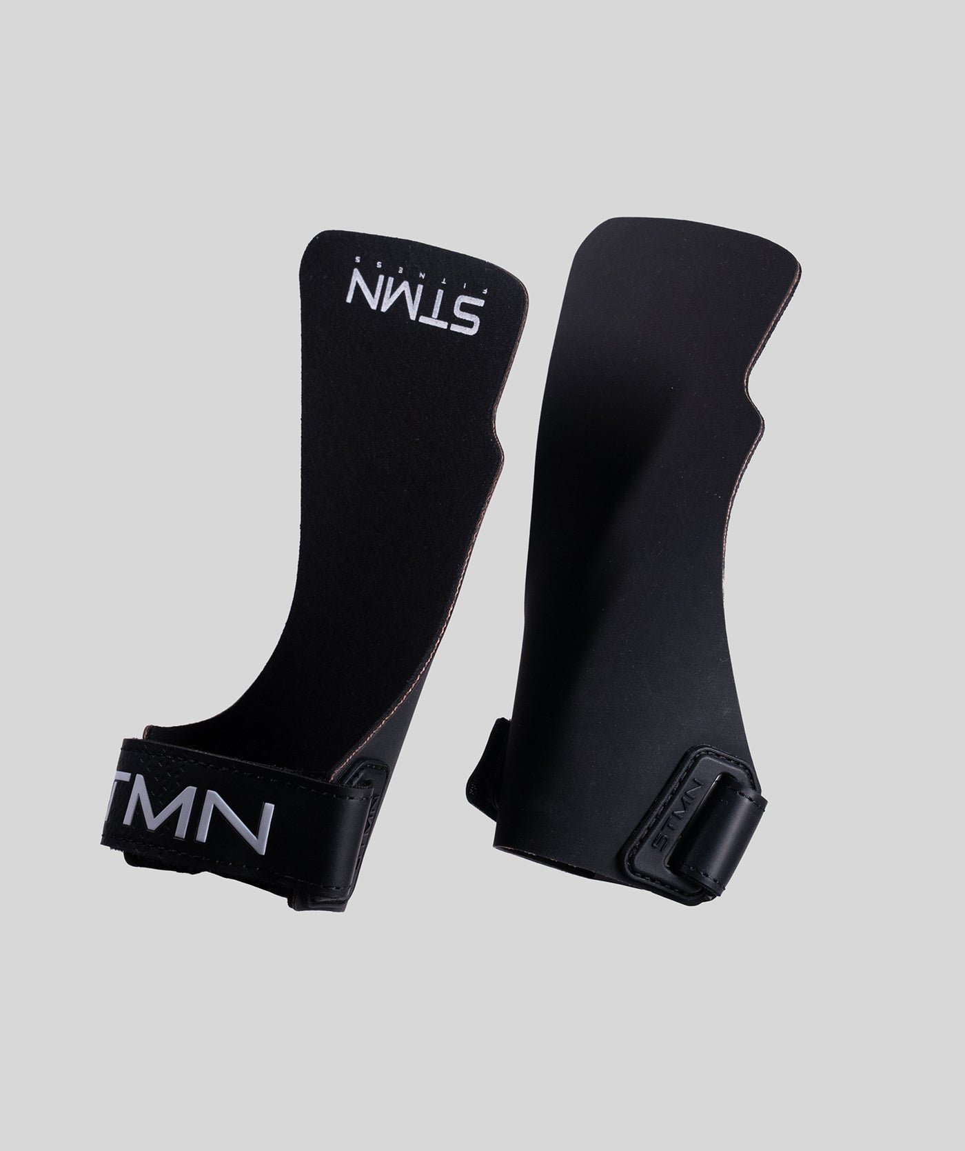 Coppia di paracalli Hybrid STMN Fitness in polimero nero, vista frontale e retro