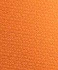 Macro della texture in gomma arancione del paracalli Zero Slim 2.0 STMN Fitness