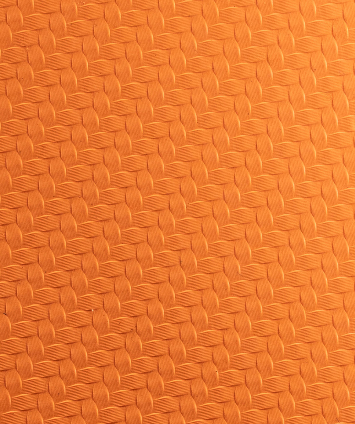 Macro della texture in gomma arancione del paracalli Zero Slim 2.0 STMN Fitness