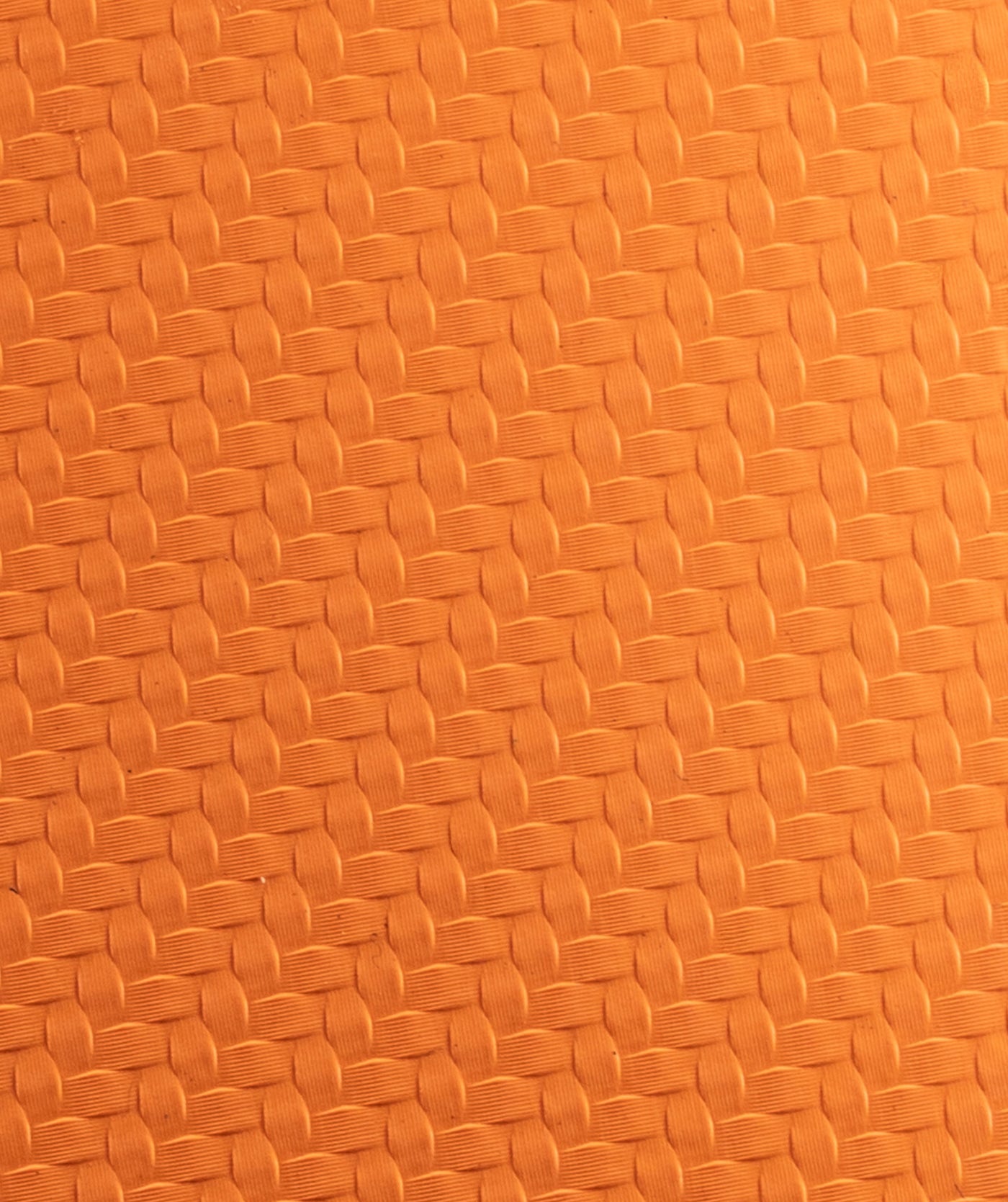 Macro della texture in gomma arancione del paracalli Zero Slim 2.0 STMN Fitness